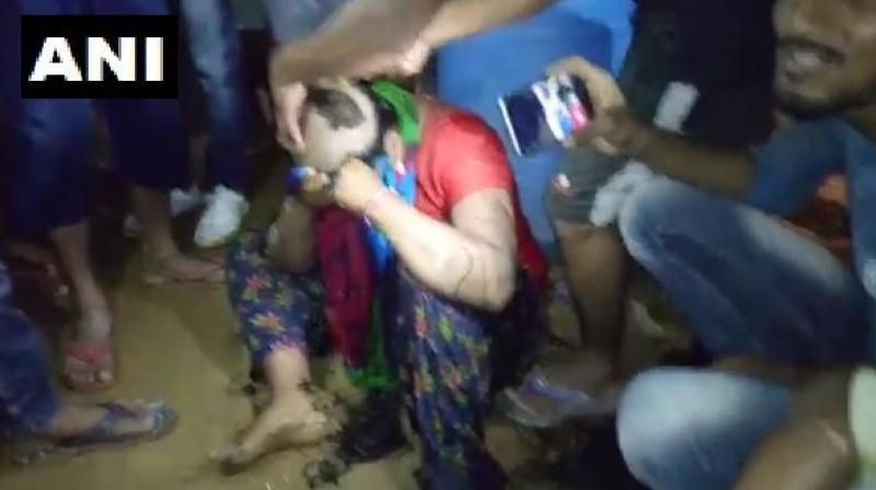 Locals allegedly broke into the womans house where the couple was present and dragged them out to assault them and then shaved their head. (Photo: ANI | Twitter)