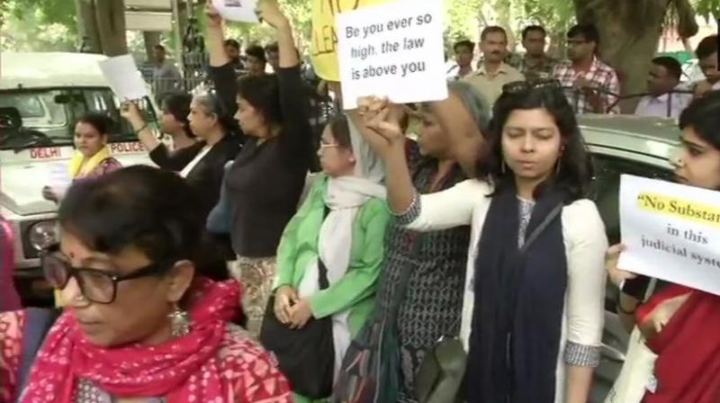 After clean chit given to CJI, women lawyers, activists protest outside SC