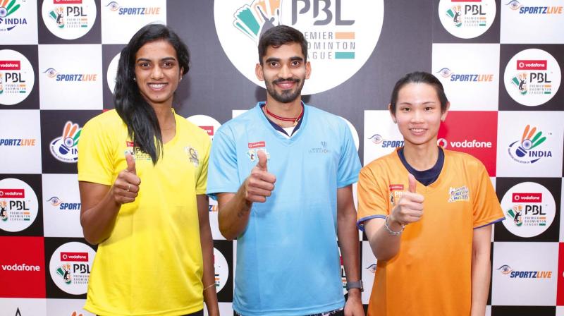 P.V. Sindhu (from left), Kidambi Srikanth and World No.1 Tai Tzu Ting pose ahead of the Dubai BWF world super series finals on Sunday.