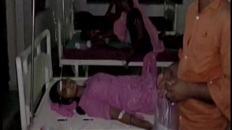 People fall ill after breaking their daily Ramzan fast at a madrassa in Harwatand village at Bahraich in UP. Photo: ANI Twitter)