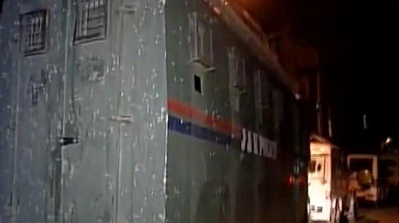 Terrorists attack a bus of security personnel at Pantha Chowk in Srinagar. (Photo: ANI | Twitter)
