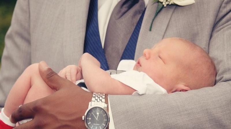 Why do people have tendency to carry babies on their left arm?