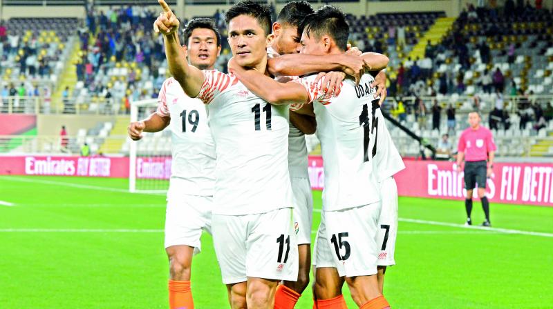 Indian forward Sunil Chhetri (11) celebrates a goal with his teammates during the AFC Asian Cup Group A match against Thailand at Al Nahyan Stadium in Abu Dhabi, United Arab Emirates, on Sunday. India won 4-1.