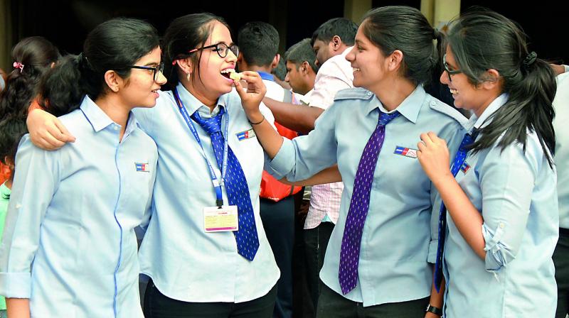 Following the declaration of the ISC results, students celebratet their results with their friends in Hyderabad  on Tuesday.(Image DC)