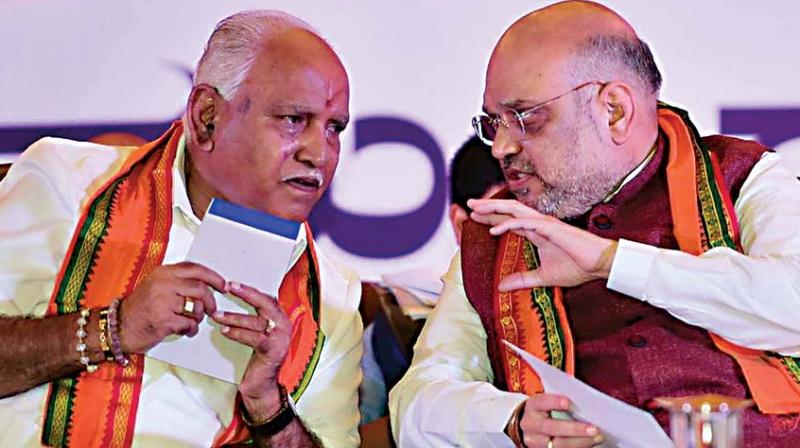 A file photo of BJP president Amit Shah with partys state unit chief B.S. Yeddyurappa