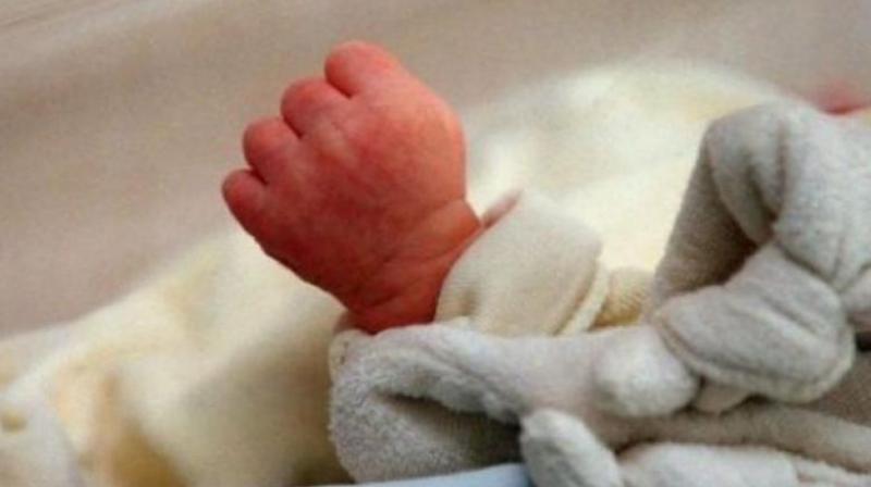 A woman admitted to the government area hospital in Kavali gave birth to a dead baby on Wednesday following which, the relatives blamed the medical staff of negligence.