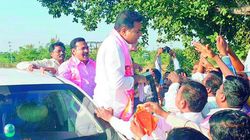 TRS leader K.T. Rama Rao greets party activists at Lingampet in Yellareddy constituency on Tuesday. (Photo: DC)