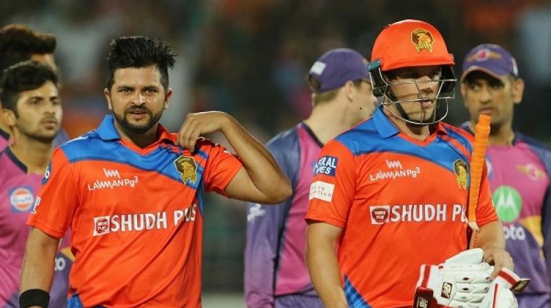Suresh Raina and Aaron Finch walk back after competing a win for Gujarat Lions. (Photo: BCCI)