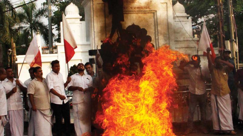 Supporters of Kerala Congress (M) MP Jose K Mani, burn the effigy of P.J. Joseph, MLA, and Monce Joseph, MLA, at Gandhi statue in Kottayam on Saturday.