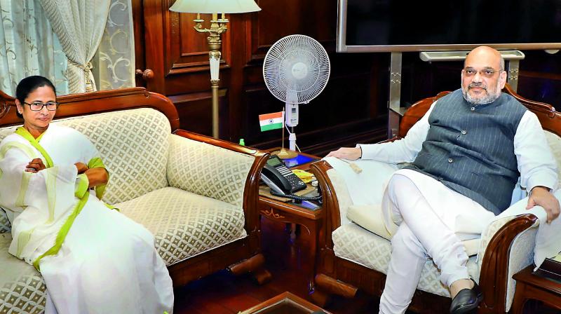 Home minister Amit Shah meets West Bengal Chief Minister Mamata Banerjee in New Delhi on Thursday.  (PTI)