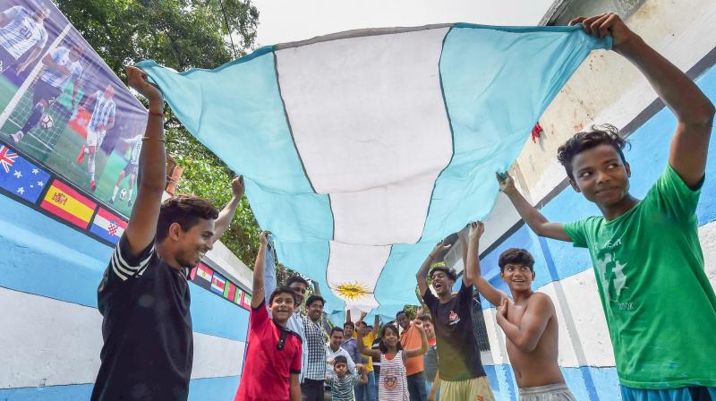 Argentina fans wave the countrys flag as a support for the ongoing FIFA World Cup in Russia. (Photo: PTI)