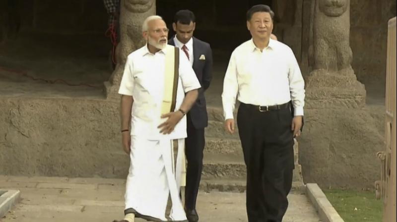 PM Modi dons Tamil Nadu\s traditional \veshti\ as he welcomes Xi Jinping