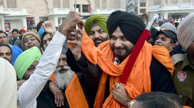 Former BJP MP turned Congressman Navjot Singh Sidhu along with other congress leaders near the golden temple in Amritsar. (Photo: PTI)