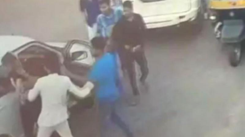 BJP MLAs son Raja was accompanied by several other men who too came out of his Scorpio car and joined Raja to beat the man. (Photo: Screengrab | ANI video)