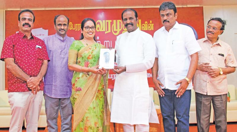 S. Malarvizhi, chairperson and managing trustee of Sri Krishna Institutions, receives a copy of book titled Tamizhattruppadai authored by poet and lyricist Vairamuthu.. (Photo: DC)