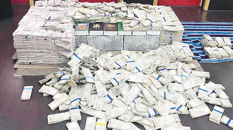 Rs 14.5 crore cash in scrapped currency that was seized from Bomb Nagas house