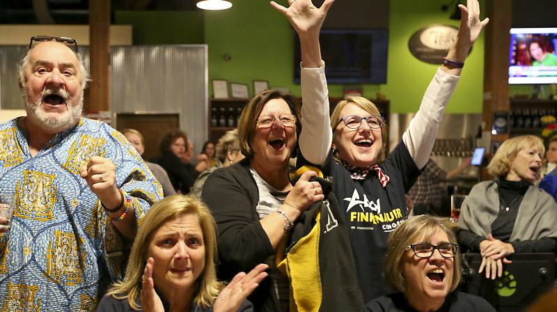 Voters react as they watch the results slowly trickle in on Wednesday. (Photo: AP)
