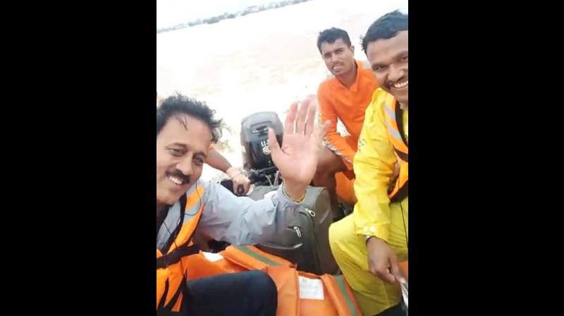 Video: Maharashtra minister receives flak over selfie videos during flood survey