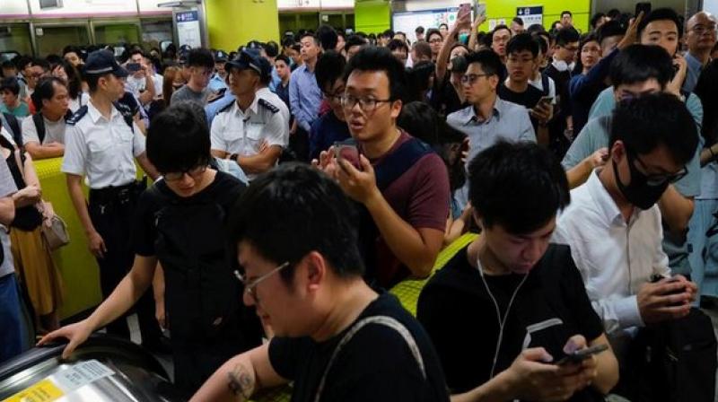 Chaos in Hong Kong as protesters disrupt metro services