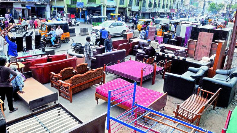 Every Sunday, old furniture traders grab nearly two-thirds of the Nampally Road near Ek Minar Masjid. (Photo: P. Surendra)