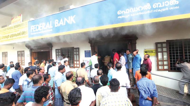Smoke billowing out of the Federal Bank branch in Alappuzha. ARRANGED