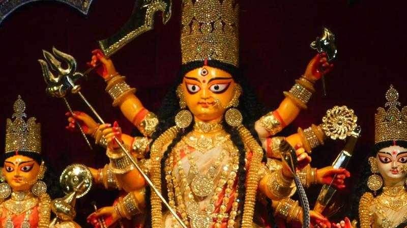 During Durga Puja, many devotees offer prayers to the Goddess precisely on the belief that she will protect them and their families in times of need. (Photo: Supratim Chakraborty)
