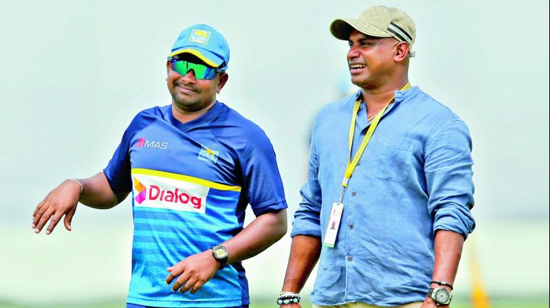 SL skipper Rangana Herath (left) and selector Sanath Jayasuriya. (Photo: AP)