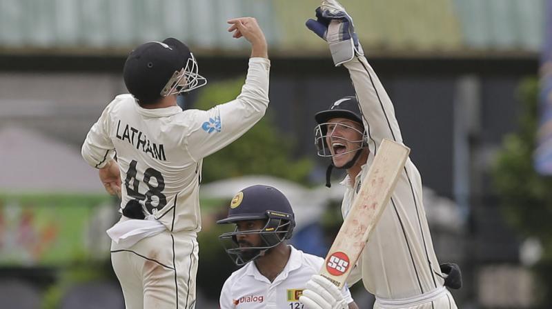 Needing 187 runs in the second innings to make New Zealand bat again, Sri Lanka was bowled out for 122 runs in the final session despite a fighting 51 off 162 deliveries from wicket-keeper Niroshan Dickwella. (Photo:AP/PTI)