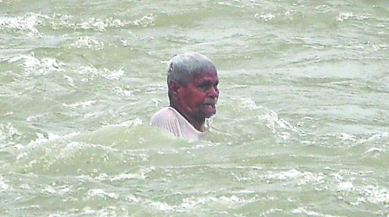 Man washed away in presence of Anilkumar Yadav