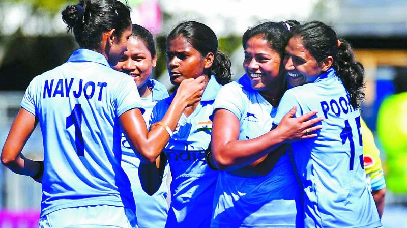 India womens hockey players celebrate their 2-1 victory over England at the Gold Coast on Sunday. (Photo: AFP)