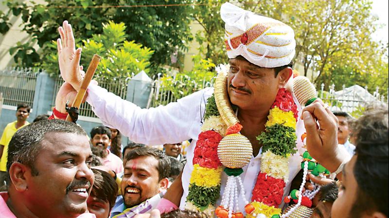 RR Nagar Congress candidate Muniratna celebrates his victory in the Assembly bypoll, in Bengaluru on Thursday  DC