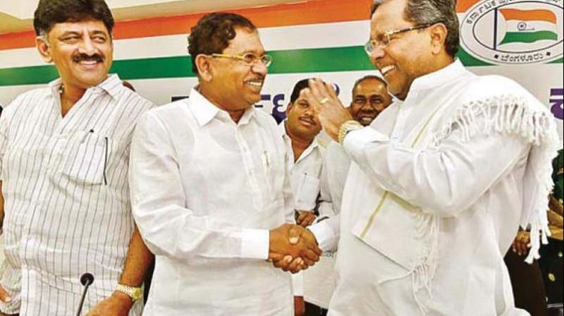 A file photo of Congress leaders Siddaramaiah, G. Parameshwar and Shivakumar