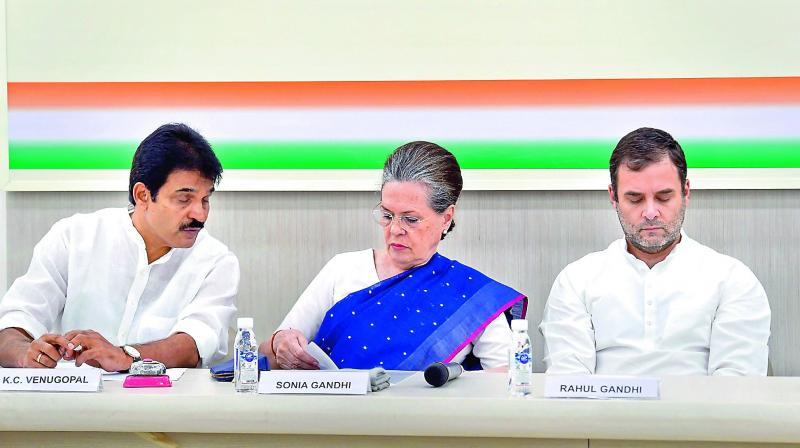 Former Congress President Rahul Gandhi with Sonia Gandhi and K.C. Venugopal during Congress Working Committee meeting in New Delhi on Saturday.  (PTI)