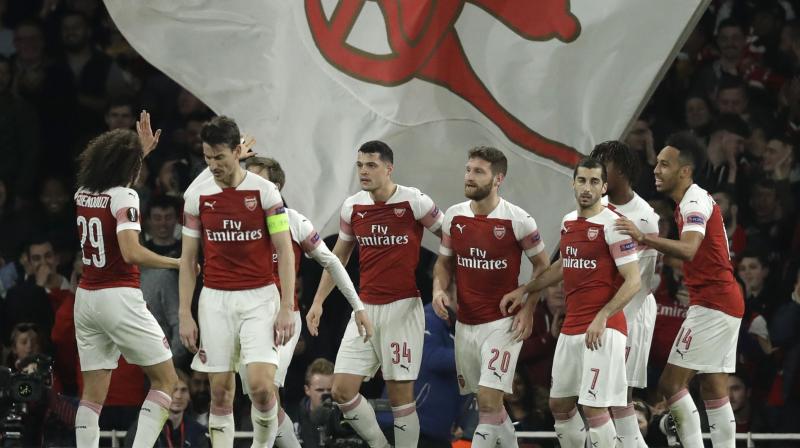 Pierre-Emerick Aubameyang forced an early own goal before center backs Shkodran Mustafi and Sokratis Papastathopoulos added one apiece for Arsenal to advance 3-1 on aggregate. (Photo: AP)