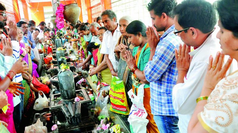 People offer special prayers to Lord Shiva to mark Shivaratri celebrations at Ramalingeswara Swamy temple near MVP Colony in Visakhapatnam on Tuesday. (Photo: DC)