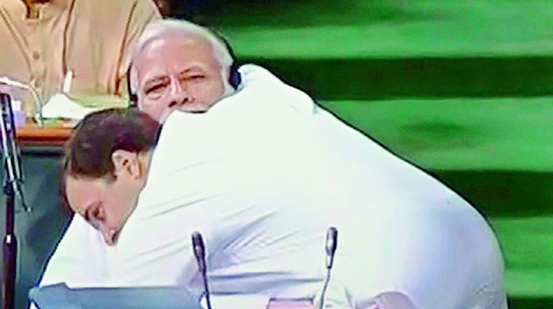 Congress president Rahul Gandhi hugs Prime Minister Narendra Modi after his speech in the Lok Sabha on Friday. (Photo: PTI)