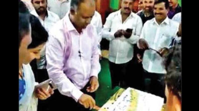 A file photo of Assembly Secretary S Murthy cutting his birthday cake at the legislative assembly lounge in Bengaluru