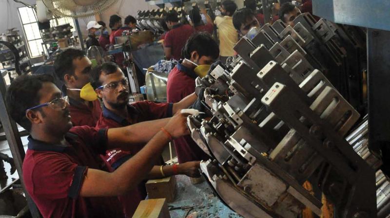 Work in full swing at PU Rotary machine at a footwear unit at Cheruvannur in Kozhikode. (Photo: Venugopal)
