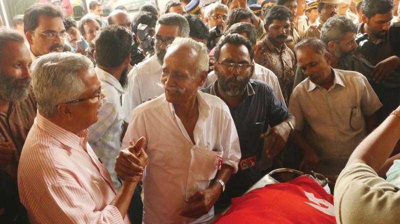 CPI leader Binoy Viswom with human rights activist Grow Vasu as he arrived to pay last respects to Maoist leader Kuppu Devaraj at MCH mortuary in Kozhikode on Friday.