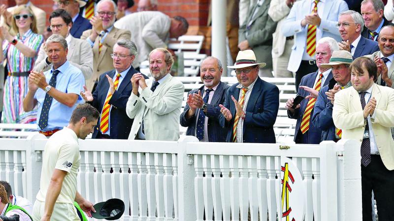 MCC members stand up to applaud Englands Chris Woakes. (Photo: AFP)