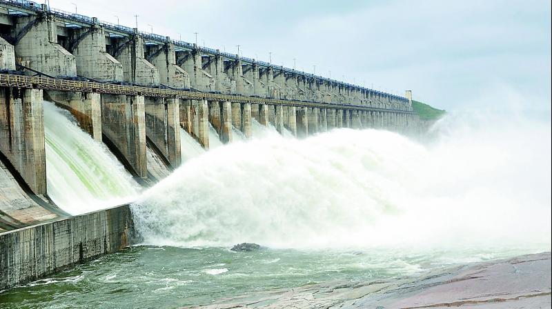 Water gushes out of the Sriramsagar project in Nizamabad district on Monday. Officials opened 16 of the projects 42 gates to let out excess water. This is for the first time that water was released from the dam this season.