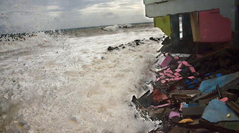 Violent waves lash the house of Alosious, a fisherman   at Valiyathura, on Monday. Sea turned turbulent ahead of the monsoon. (Photo: Peethambaran Payyeri)