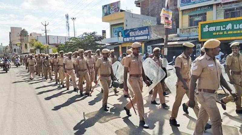Police stage a flag march in Ponnamaravathi on Saturday. 	(DC)