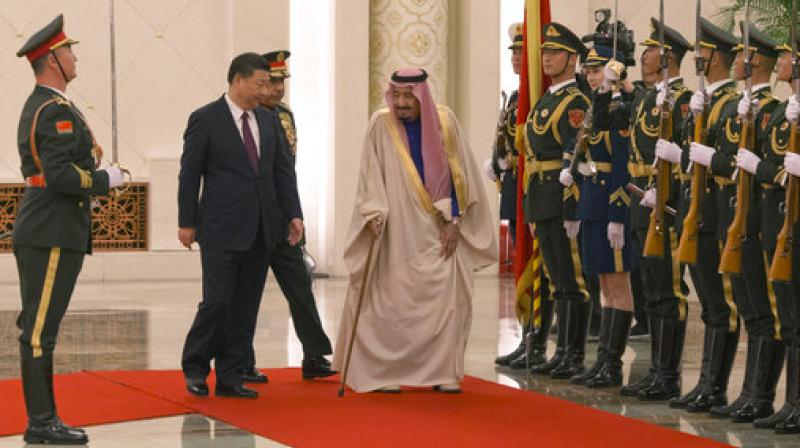 Chinese President Xi Jinping and Saudi Arabias King Salman inspect a Chinese guard of honor during a welcome ceremony in Beijing, China. (Photo: AP)