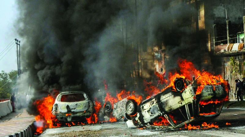 Vehicles set on fire by protesters against the killing of CRPF personnel in the Pulwama terror attack.