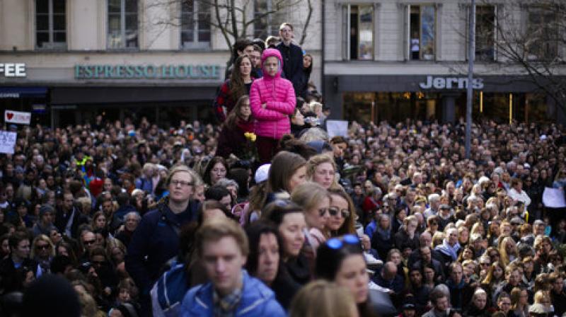 Thousands of people attended a Lovefest vigil against terrorism in Sergels Torg, central Stockholm, Sweden. (Photo: AP)