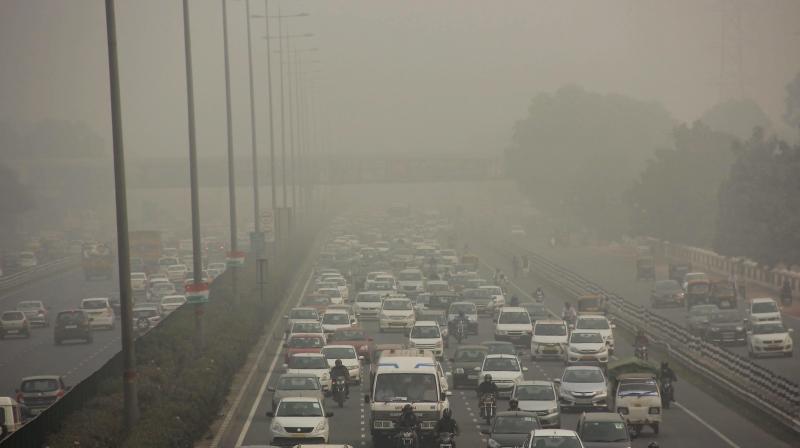 Vehicles ply on Gurgaon-Delhi Expressway through dense smog in Gurugram. (Photo: PTI)