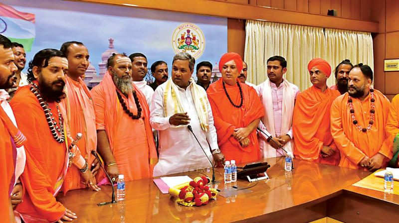 CM Siddaramaiah at a discussion with seers of the Veerashaiva community at his home office, Krishna, in Bengaluru on Wednesday