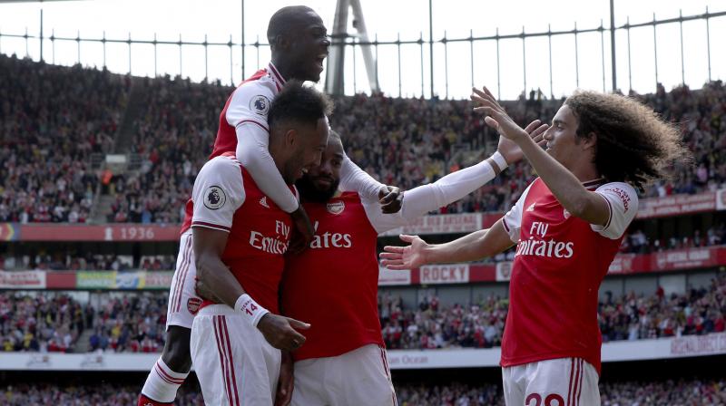 Pierre-Emerick Aubameyang says Arsenal could try to fight fire with fire on Saturday by deploying him in a front three alongside Alexandre Lacazette and Nicolas Pepe when they travel to face Liverpools attacking trio of Mohamed Salah, Sadio Mane and Roberto Firmino combined for 69 goals and 19 assists in all competitions last season and Pierre-Emerick Aubameyang labelled them one of the best trios in the world. (Photo:AP)