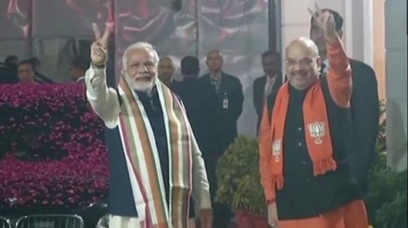 UP CM Yogi Adityanath thanked the voters for the win, saying, People have rejected divisive politics of Congress. (In picture: PM Modi arrives at BJP HQ in Delhi, received by BJP President Amit Shah. Photo: ANI)